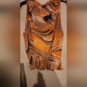 A Women's orange and brown blouse